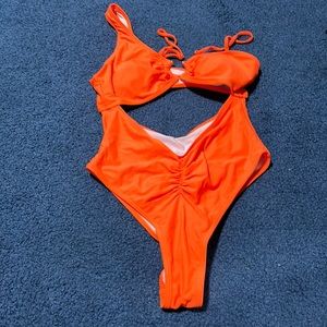 Women’s orange high cut bathing suit